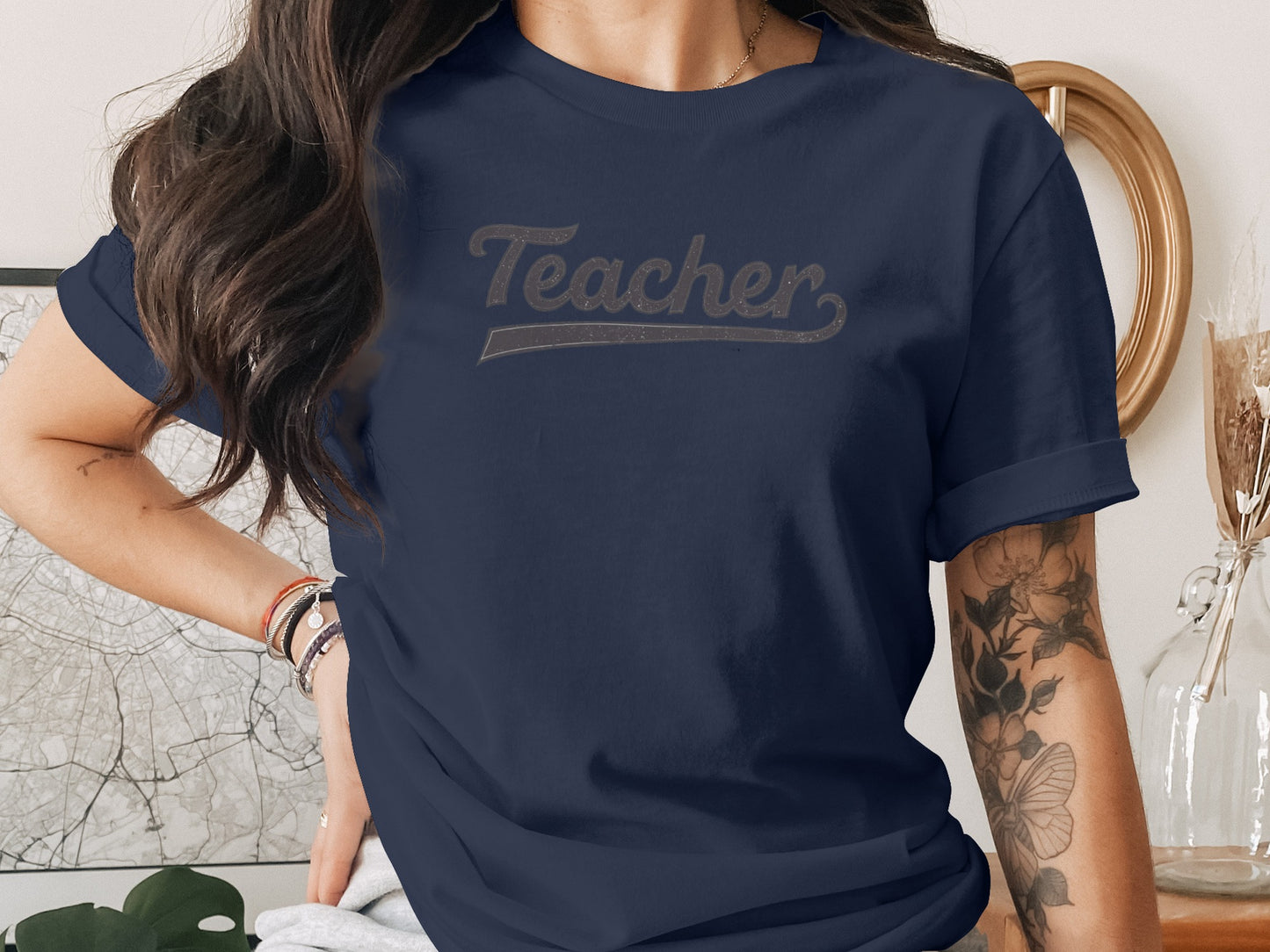 Navy t-shirt with "Teacher" text across the chest.